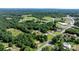 Expansive aerial view features lush greenery, homes, a water tower, and a picturesque landscape at 3423 S Hwy 127 Hwy, Hickory, NC 28602