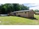 Back exterior with brick siding, patio, large yard, and above ground pool at 3423 S Hwy 127 Hwy, Hickory, NC 28602