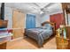 Comfortable bedroom with laminate floors and a ceiling fan and wood wall feature at 3423 S Hwy 127 Hwy, Hickory, NC 28602