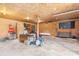Large unfinished garage space with exposed wood paneling, storage, and a concrete floor at 3423 S Hwy 127 Hwy, Hickory, NC 28602