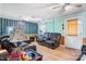 Relaxing living room featuring laminate floors, a ceiling fan, and comfortable seating at 3423 S Hwy 127 Hwy, Hickory, NC 28602
