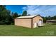 Large outbuilding with a metal exterior, roll up door, and spacious green lawn at 3423 S Hwy 127 Hwy, Hickory, NC 28602