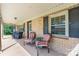 Cozy front porch with brick facade, comfortable seating, and classic design elements at 3423 S Hwy 127 Hwy, Hickory, NC 28602