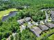 Stunning aerial view of homes near a golf course and lake, nestled in a lush green environment at 35115 Carnation Ln, Fort Mill, SC 29707