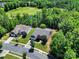Stunning aerial view showcasing the home's landscaping near a lush golf course at 35115 Carnation Ln, Fort Mill, SC 29707
