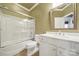 This bathroom features a shower and bathtub combination with a white vanity at 35115 Carnation Ln, Fort Mill, SC 29707