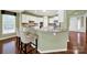 Eat-in kitchen features granite countertops, island seating, and modern appliances at 35115 Carnation Ln, Fort Mill, SC 29707