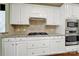 Updated kitchen boasting granite countertops, stainless appliances, and gas cooktop at 35115 Carnation Ln, Fort Mill, SC 29707