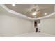 This main bedroom includes neutral paint and carpet, crown molding, and a ceiling fan at 35115 Carnation Ln, Fort Mill, SC 29707