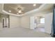 This main bedroom includes neutral paint, a tray ceiling with a ceiling fan, and an ensuite bathroom at 35115 Carnation Ln, Fort Mill, SC 29707