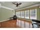Cozy sunroom featuring hardwood floors, large windows with natural light, and relaxing furniture at 35115 Carnation Ln, Fort Mill, SC 29707