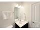 Bathroom features a vanity with a sink, a large mirror, and modern fixtures, with a nearby toilet at 3807 Blazeprince Dr, Charlotte, NC 28215
