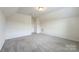 Spacious bedroom features neutral walls, carpet, and has ample natural light at 3807 Blazeprince Dr, Charlotte, NC 28215