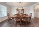 Formal dining room features a large wooden table with ornate chairs and a decorative centerpiece at 3807 Blazeprince Dr, Charlotte, NC 28215