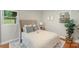 Inviting bedroom featuring a comfortable queen bed, soft neutral tones, and ample natural light at 3900 Colebrook Rd, Charlotte, NC 28215