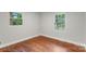 This bedroom offers hardwood floors and plenty of natural light, creating a cozy and welcoming atmosphere at 3900 Colebrook Rd, Charlotte, NC 28215