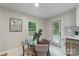 Bright dining area with modern decor, including a round table and stylish chairs, perfect for cozy meals at 3900 Colebrook Rd, Charlotte, NC 28215