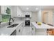 Bright, updated kitchen with white cabinetry, stainless appliances, and a sleek countertop at 3900 Colebrook Rd, Charlotte, NC 28215