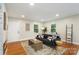 Bright living space with hardwood floors, a fireplace, and an open floor plan at 3900 Colebrook Rd, Charlotte, NC 28215