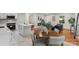 Open living space with a modern kitchen, dining area, and a cozy living room with a fireplace at 3900 Colebrook Rd, Charlotte, NC 28215