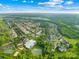 An aerial view of the community featuring a pool, tennis court, playground, and green spaces throughout the neighborhood at 3938 Isenhour Rd, Kannapolis, NC 28081