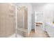 Contemporary bathroom with a tiled shower, glass door, and neutral finishes at 3938 Isenhour Rd, Kannapolis, NC 28081