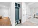Bright entryway with built-in storage bench and coat hooks offers both style and organization at 3938 Isenhour Rd, Kannapolis, NC 28081