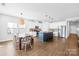 Spacious, bright kitchen with island seating, stainless steel appliances, a dining area, and lots of natural light at 3938 Isenhour Rd, Kannapolis, NC 28081