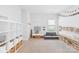 Bright and fun playroom with natural light, custom shelving, and cozy seating area at 3938 Isenhour Rd, Kannapolis, NC 28081