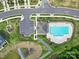 Aerial view of community pool, amenities, and surrounding green spaces, highlighting a vibrant neighborhood at 4003 Rothwood Ln, Harrisburg, NC 28075