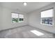 Bedroom featuring neutral walls, carpet and trim, two windows and recessed lighting at 4003 Rothwood Ln, Harrisburg, NC 28075