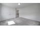 Bright bedroom with a closet and a neutral color scheme, creating a serene and inviting space at 4003 Rothwood Ln, Harrisburg, NC 28075