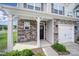 Inviting front entry with stone accents and a well-maintained facade, highlighting the home's architectural details at 4003 Rothwood Ln, Harrisburg, NC 28075