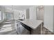 Stylish kitchen island, stainless steel appliances, and a modern faucet, perfect for culinary adventures and gatherings at 4003 Rothwood Ln, Harrisburg, NC 28075