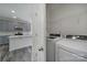 View into kitchen area and laundry room with modern appliances and ample storage space at 4003 Rothwood Ln, Harrisburg, NC 28075