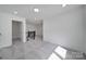 Spacious loft with neutral carpet and dark wood trim overlooks lower level at 4003 Rothwood Ln, Harrisburg, NC 28075