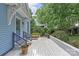 Inviting deck with comfortable seating, lush plants and trees at 413 E Worthington Ave, Charlotte, NC 28203