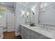 Bright bathroom features double sinks, marble countertop, and modern fixtures at 413 E Worthington Ave, Charlotte, NC 28203