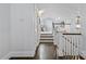 Upstairs hallway leads to rooms with a drum set and offers a view of the staircase at 413 E Worthington Ave, Charlotte, NC 28203