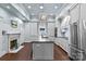 Bright kitchen with stainless appliances, island, and double pendant lighting at 413 E Worthington Ave, Charlotte, NC 28203