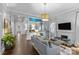 Spacious living room with hardwood floors, stylish decor, fireplace, and plenty of natural light at 413 E Worthington Ave, Charlotte, NC 28203