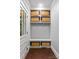 Mudroom featuring built-in storage, a bench, and baskets for organized entryway at 413 E Worthington Ave, Charlotte, NC 28203