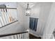 Staircase with natural lighting features an ornamental light fixture and wall decoration at 413 E Worthington Ave, Charlotte, NC 28203