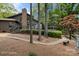 Home with a spacious backyard featuring mature trees, a walking path and lush greenery at 449 Windward Dr, Davidson, NC 28036