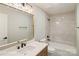 Stylish bathroom featuring a single sink vanity, quartz countertops and a shower and tub at 449 Windward Dr, Davidson, NC 28036