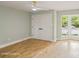 Light filled bedroom featuring hardwood floors, neutral paint, a ceiling fan and a bay window at 449 Windward Dr, Davidson, NC 28036