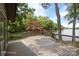 Inviting deck offers a peaceful view of the lake and verdant trees, perfect for relaxation and enjoyment at 449 Windward Dr, Davidson, NC 28036