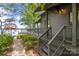 Charming lake house with a wraparound deck and lush landscaping at 449 Windward Dr, Davidson, NC 28036