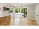 Kitchen featuring granite countertops, custom cabinets, modern hardware, and a view of the neighborhood street at 449 Windward Dr, Davidson, NC 28036