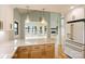Kitchen featuring custom cabinets, stone countertops, and views to the living space and lake view deck at 449 Windward Dr, Davidson, NC 28036